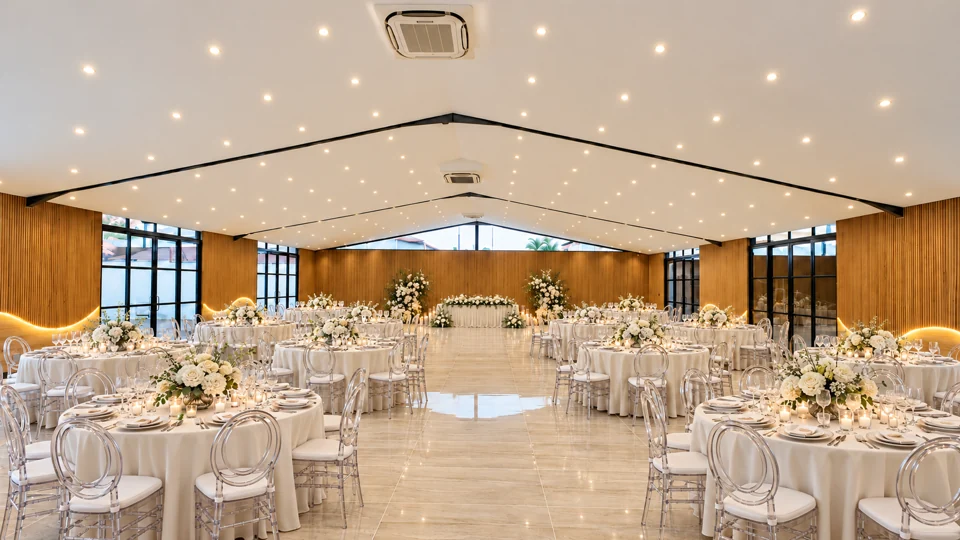 Lakefield wedding hall with round tables, chairs and floral table settings
